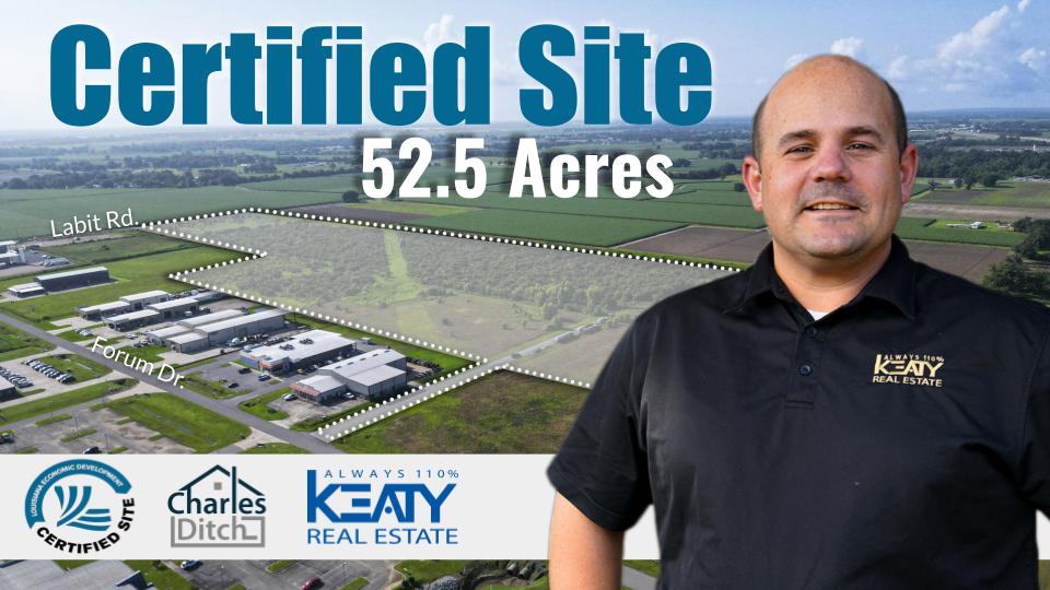 Real estate agent Charles Ditch in front of an aerial map of the 52.5-acre Labit Road Certified Site for sale in Broussard, Louisiana.